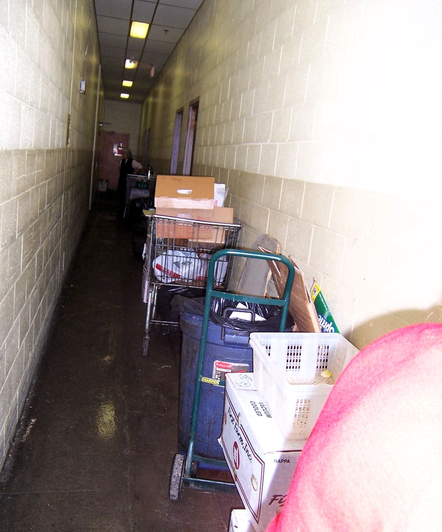 Fire Hazard Identified: Obstructed Emergency Egress Path 🚨
This image shows a blocked emergency exit corridor, which poses a serious fire and life safety hazard. Key Fire Code Violations:
🔴 Obstructed Egress Path – The corridor is cluttered with carts, boxes, trash bins, and miscellaneous items, restricting movement.
🔴 Potential Fire Load – The presence of cardboard, plastic, and other combustibles increases fire spread risk.
🔴 Impeded Emergency Evacuation – In case of a fire or emergency, occupants may be trapped or delayed, leading to possible injuries or fatalities. Corrective Actions:
✔️ Immediate Removal of Obstructions – Keep all exit routes clear per NFPA 101: Life Safety Code and OSHA regulations.
✔️ Implement Regular Inspections – Assign personnel to ensure corridors remain free of blockages at all times.
✔️ Post Signage & Educate Staff – Install clear "Keep Clear" signs and train staff on the importance of unobstructed egress paths.
✔️ Check Emergency Lighting & Exit Signs – Ensure all exit signs are visible and lighting is functional in case of an emergency
