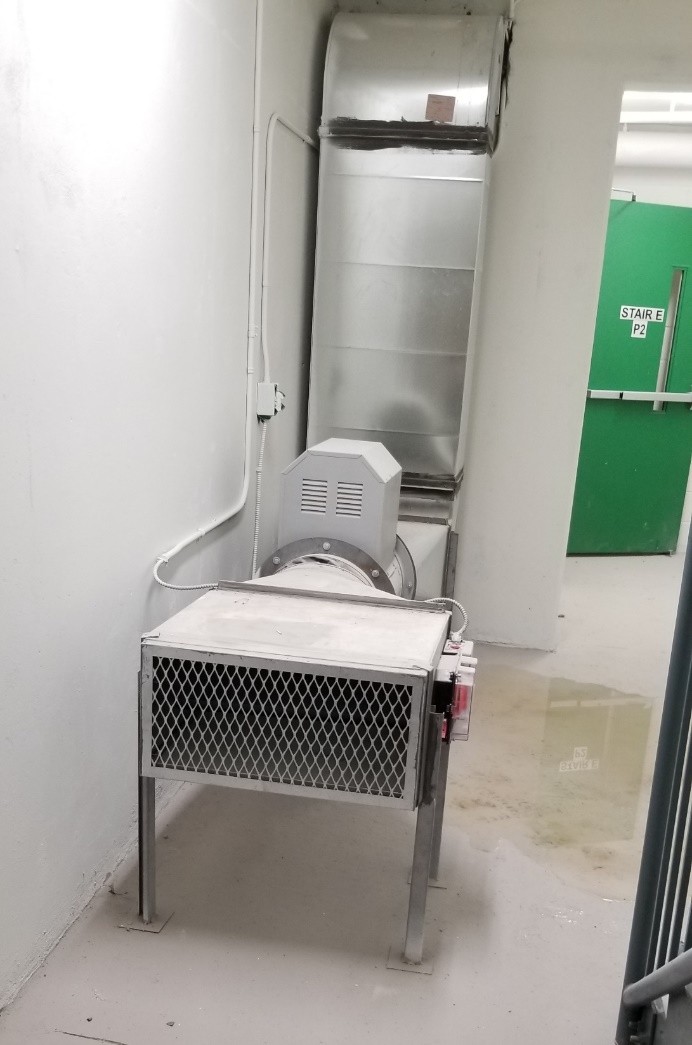 This appears to be a stairwell pressurization fan, which is a critical component of a building’s fire safety system. It helps maintain positive pressure in stairwells to prevent smoke from infiltrating escape routes during a fire, ensuring safe evacuation. Key Fire Safety Considerations for Stairwell Pressurization Systems:
Proper Installation & Maintenance Ensure the fan is correctly installed, with ductwork and electrical connections securely in place.
Regular maintenance and inspections should be conducted to check for dust accumulation, electrical faults, or mechanical failures.
Adequate Pressurization Levels The fan should provide sufficient airflow to maintain positive pressure without making doors difficult to open.
Pressure levels should comply with fire codes and be tested periodically.
Emergency Power Supply The pressurization system should be connected to a backup power source to function during a power failure.
Water Intrusion Prevention
Compliance with Building Codes
The system must adhere to NFPA (National Fire Protection Association) standards and local fire codes to ensure effectiveness in an emergency
